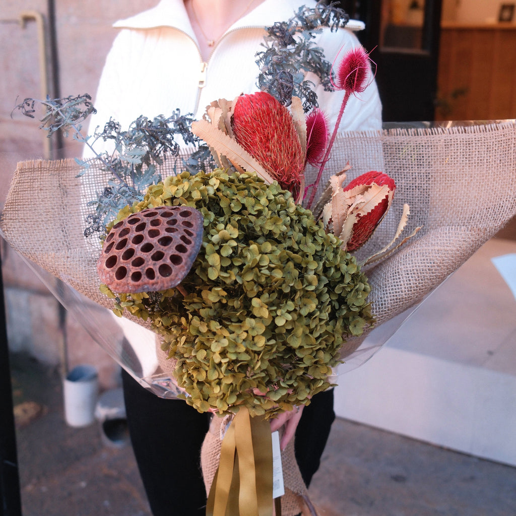 Close-up of Native Reverie bouquet featuring dried native pods and silver foliage, Hanaya Flora Surry Hills