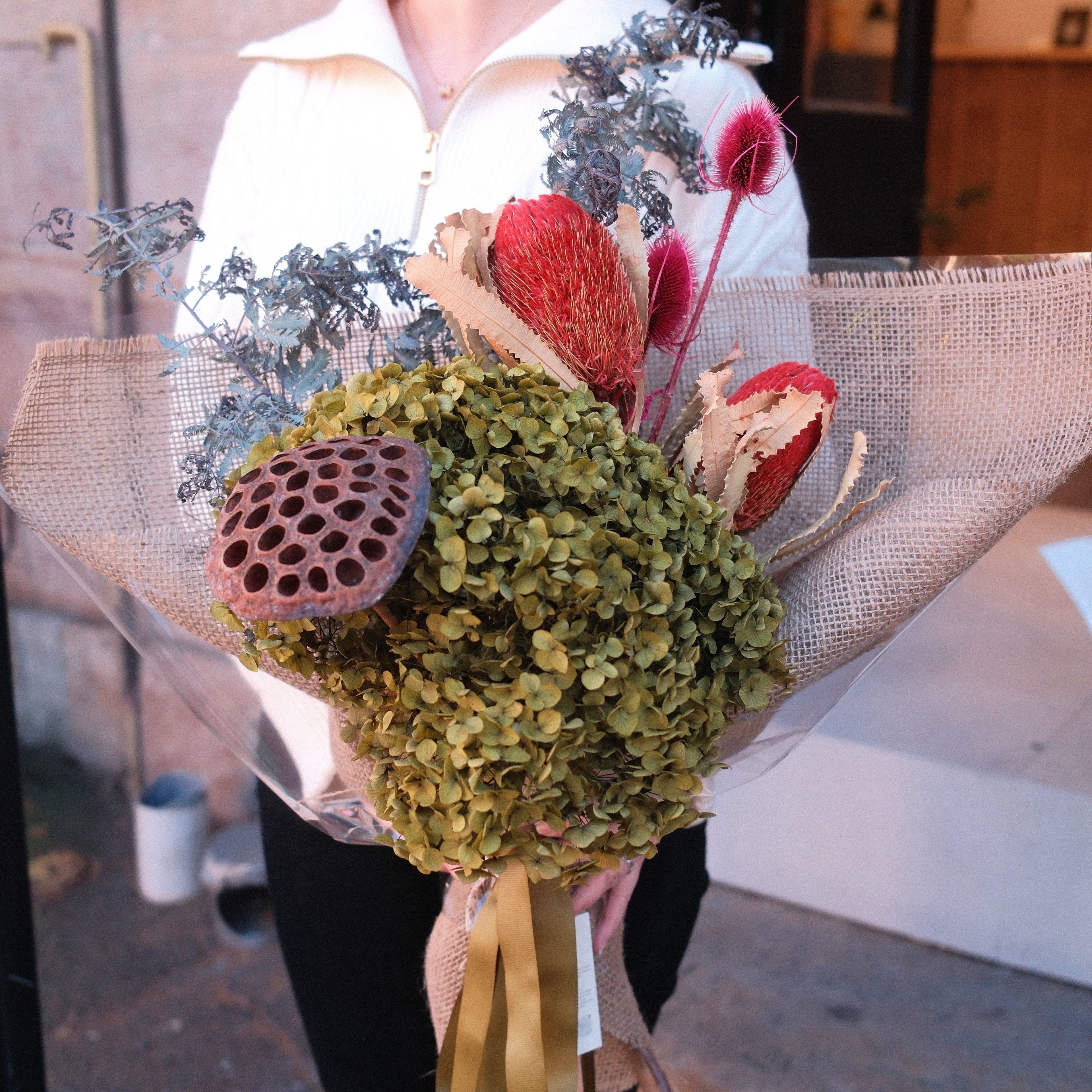 Close-up of Native Reverie bouquet featuring dried native pods and silver foliage, Hanaya Flora Surry Hills