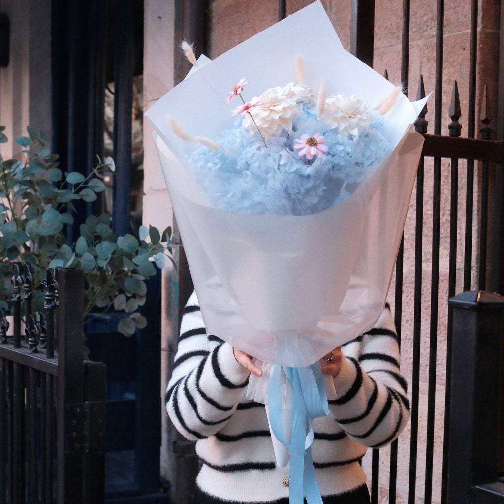 Close-up of Blue Love bouquet featuring hand-crafted blooms and bunny tail grass, Hanaya Flora