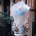 Close-up of Blue Love bouquet featuring hand-crafted blooms and bunny tail grass, Hanaya Flora