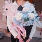 Blue Sorbet preserved bouquet held by a customer, Hanaya Flora Surry Hills