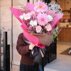 Blush Bloom bouquet detail showing pink carnation, dahlia and dried grass accents