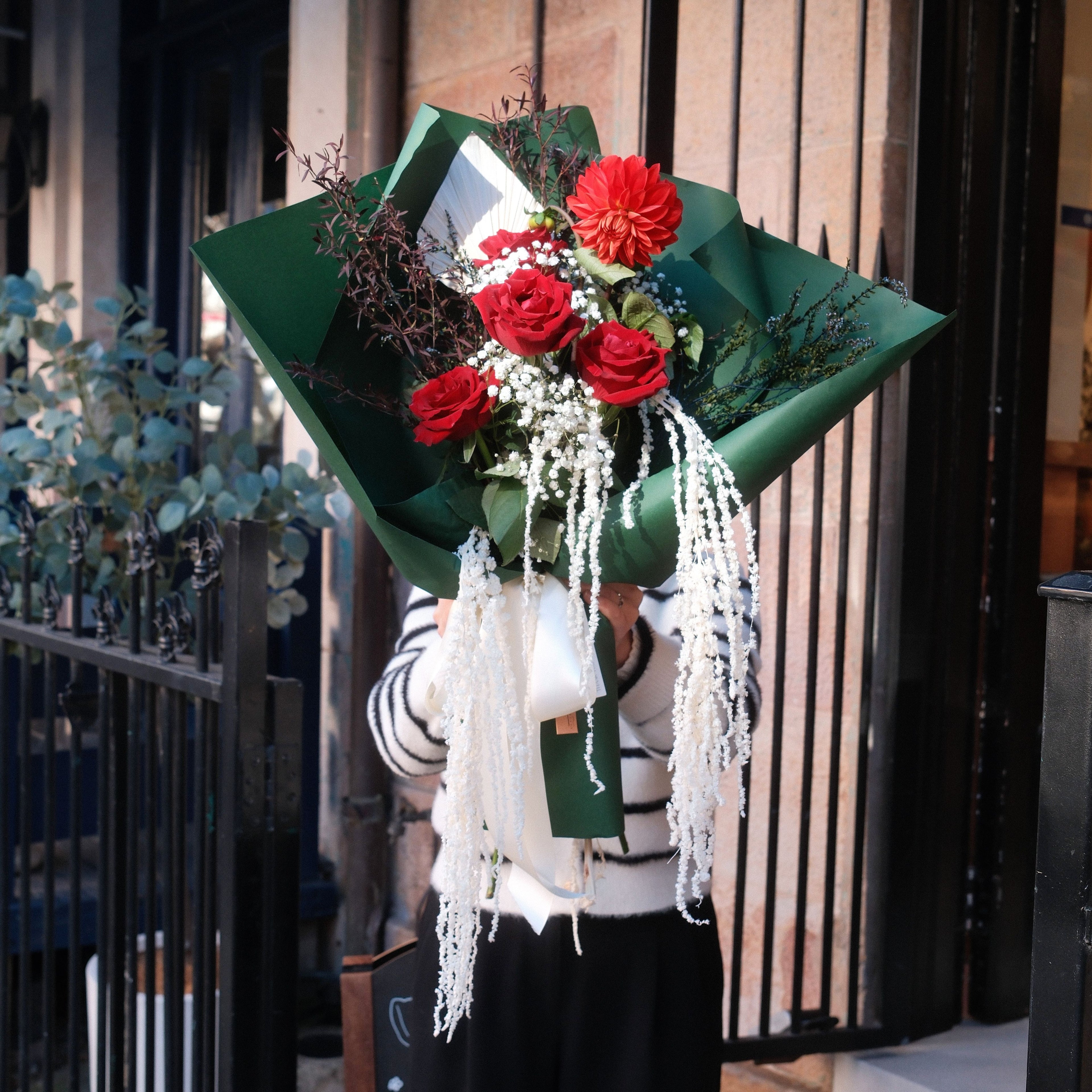 Crimson Cascade bouquet with red roses, dahlia and preserved amaranthus by Surry Hills florist Hanaya Flora