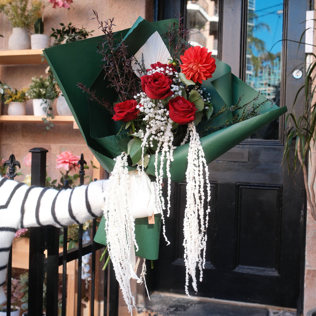 Crimson Cascade bouquet displayed outside the Hanaya Flora storefront in Surry Hills