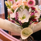 Florist holding the Yume Melody bouquet inside the Surry Hills flower shop