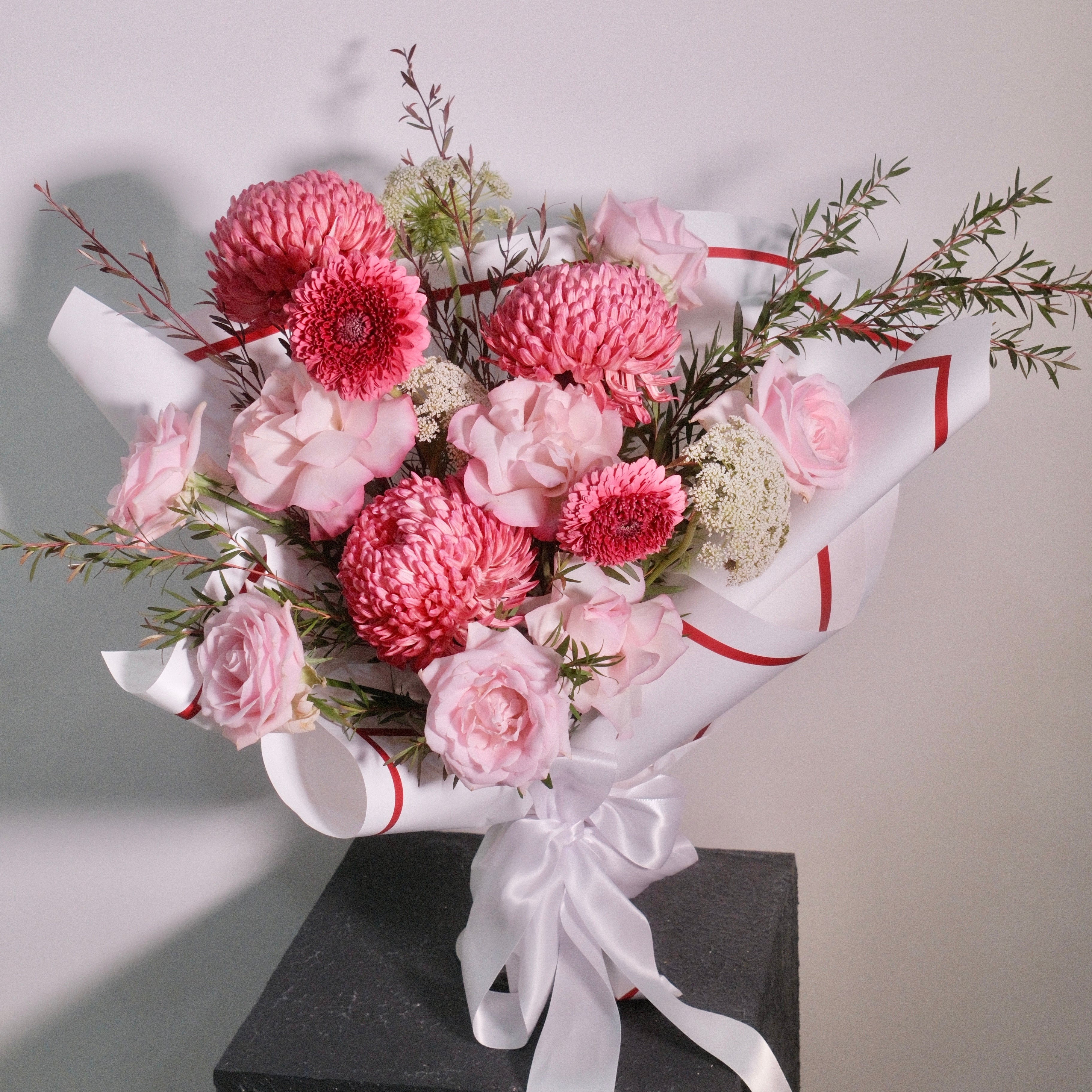 Flowers for mum bouquet held up, pink rose and chrysanthemum gift, Sydney flower delivery