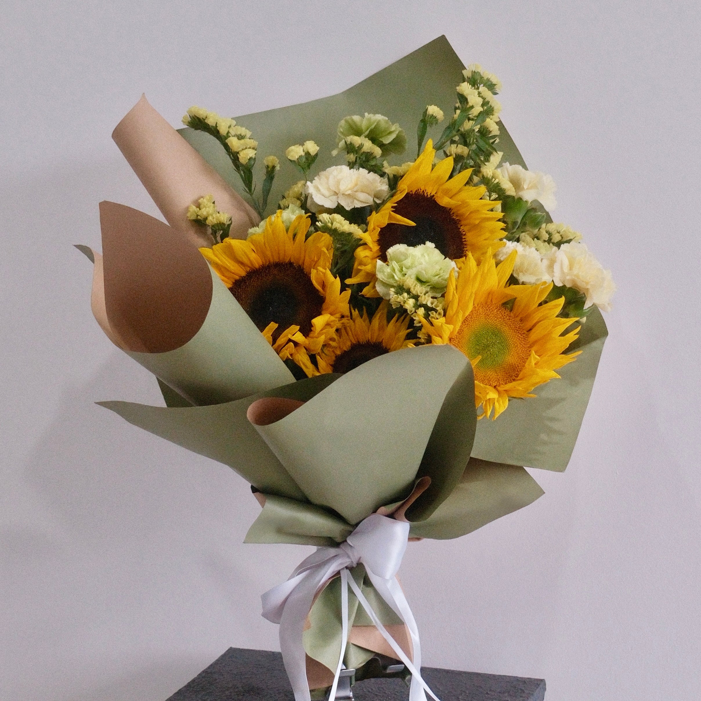 Golden Hikari sunflower bouquet styled on a pedestal, a graduation gift, Sydney
