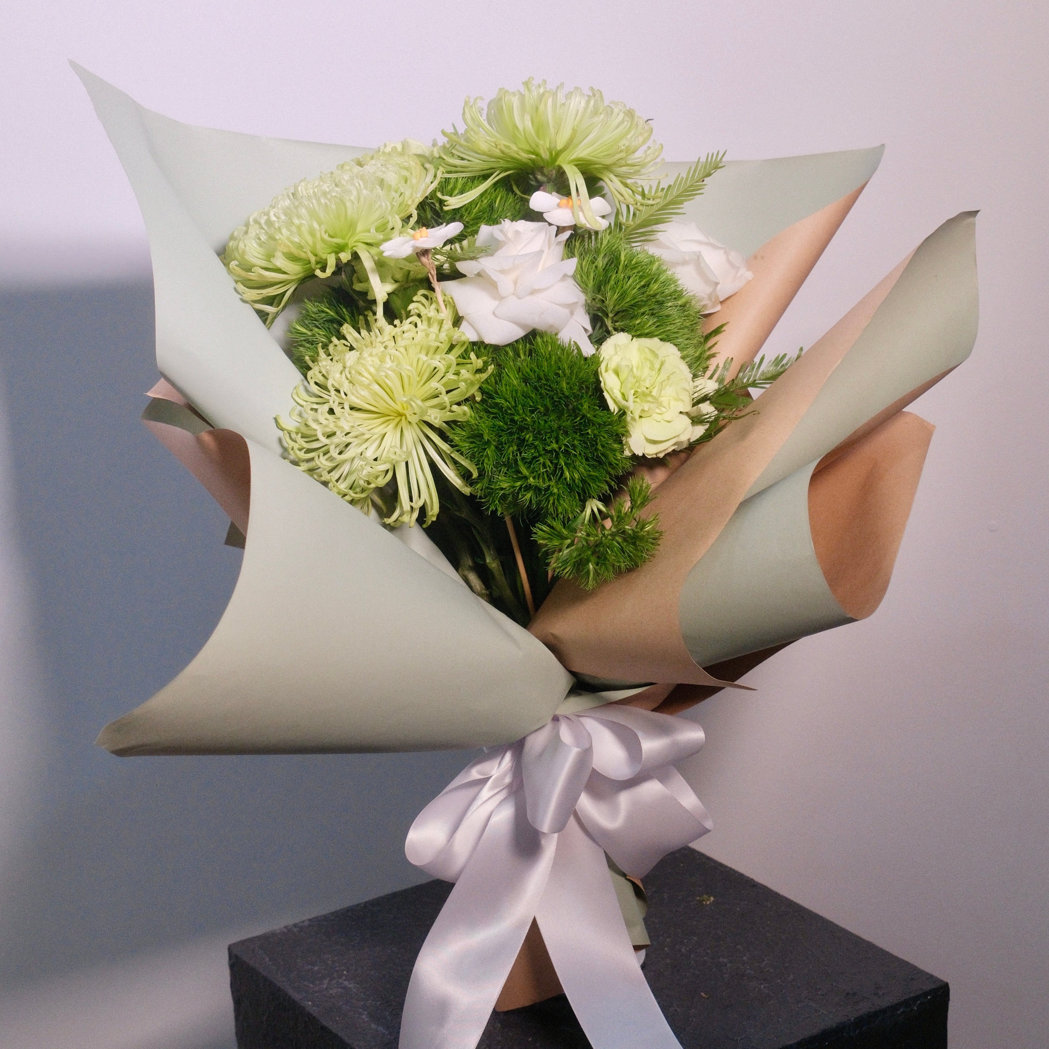 Gift the Wakaba Graduation Bouquet – crisp white & lush green blooms perfect for graduation, spring celebrations, and congratulating achievements, by Hanaya Flora, based in Sydney.