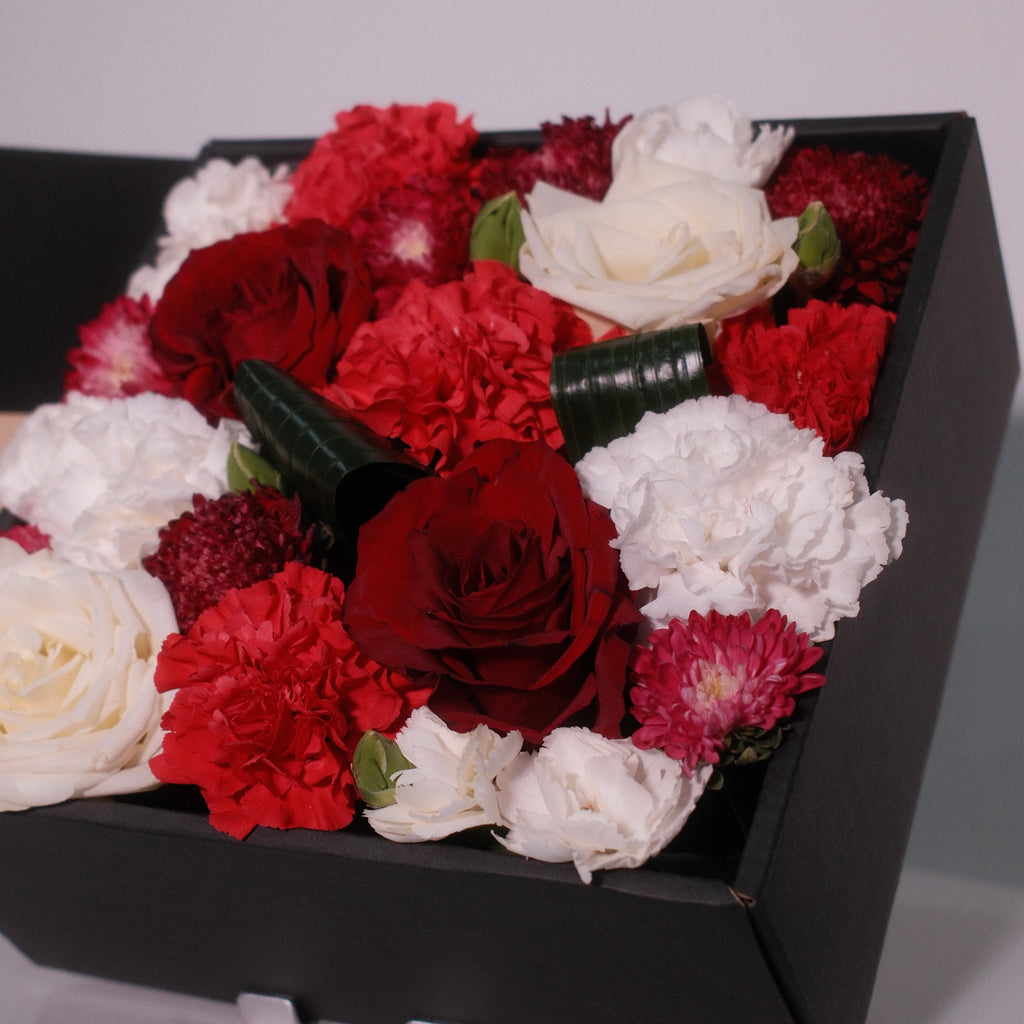 Hanaya Box Red flower box with red and white roses in a modern black box, Sydney