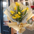 Florist holding the Harezora tulip bouquet, a seasonal birthday flower gift, Sydney