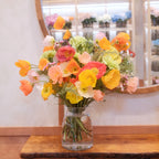 Hinata August birthday bouquet, medium size, with colorful poppies in a clear glass vase