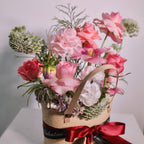 Home in Bloom woven basket arrangement with roses and seasonal blooms, a romantic gift, Sydney