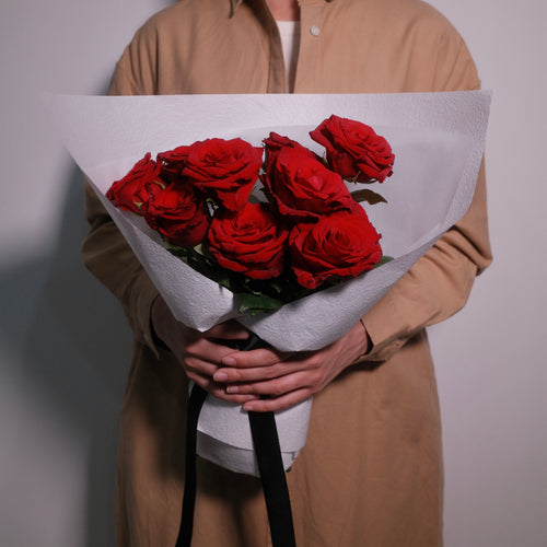 Premium flower bouquet of red roses wrapped in white paper with a black ribbon, by Hanaya Flora, Surry Hills, Sydney.