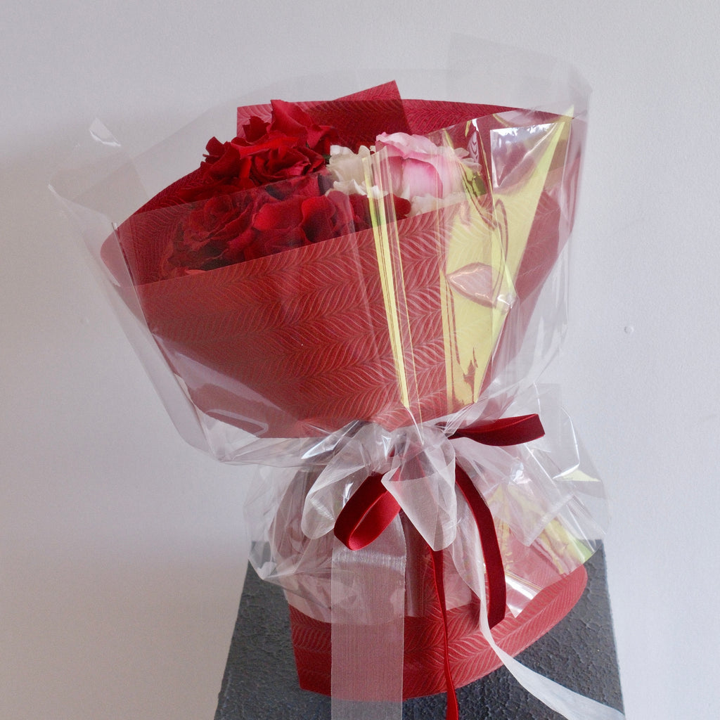 Mika Harmony red and blush bouquet styled on a pedestal, a romantic gift, Sydney