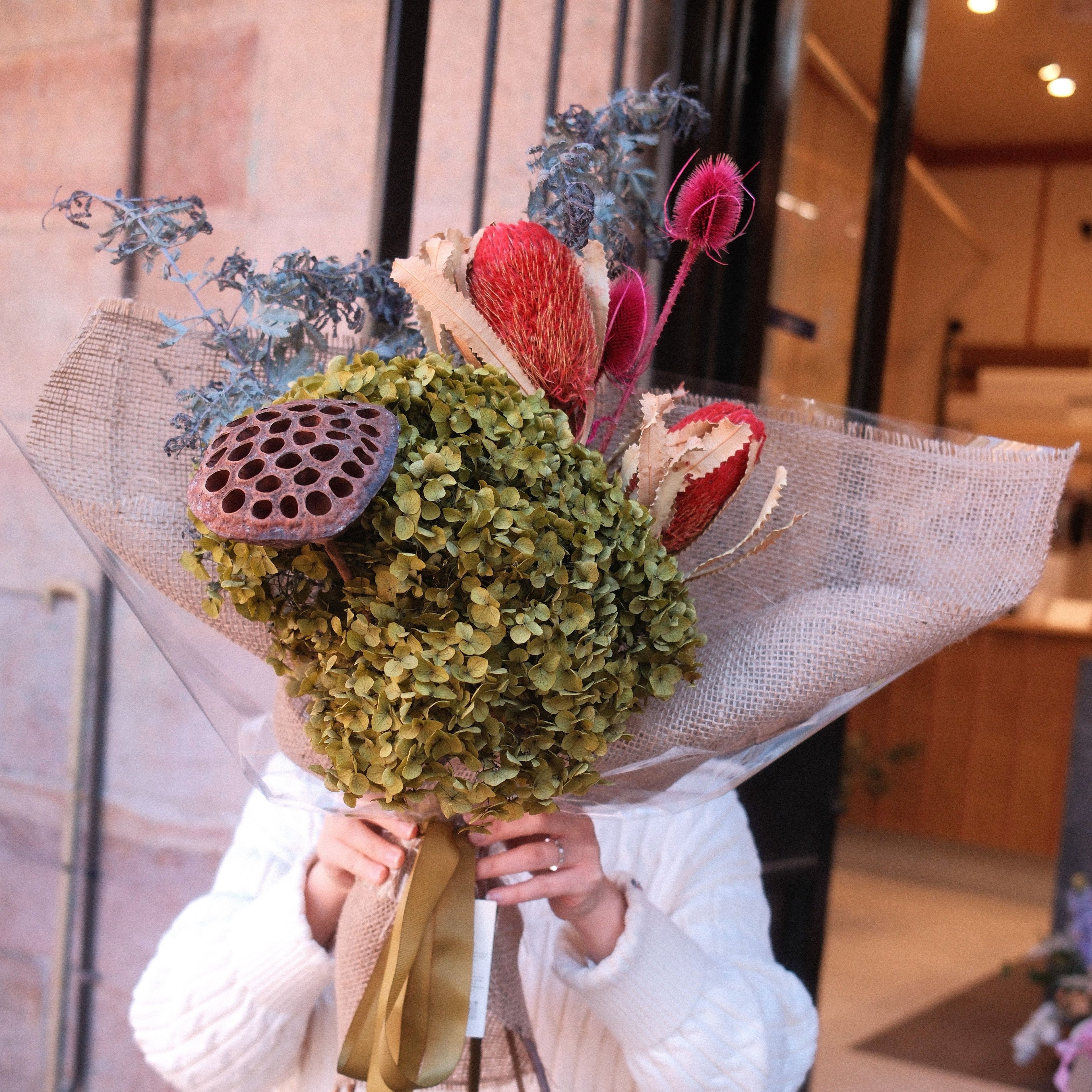Native Reverie dried and preserved bouquet held outside Hanaya Flora, Surry Hills