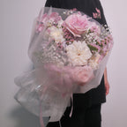 Florist holding the First Love bouquet, a romantic anniversary gift