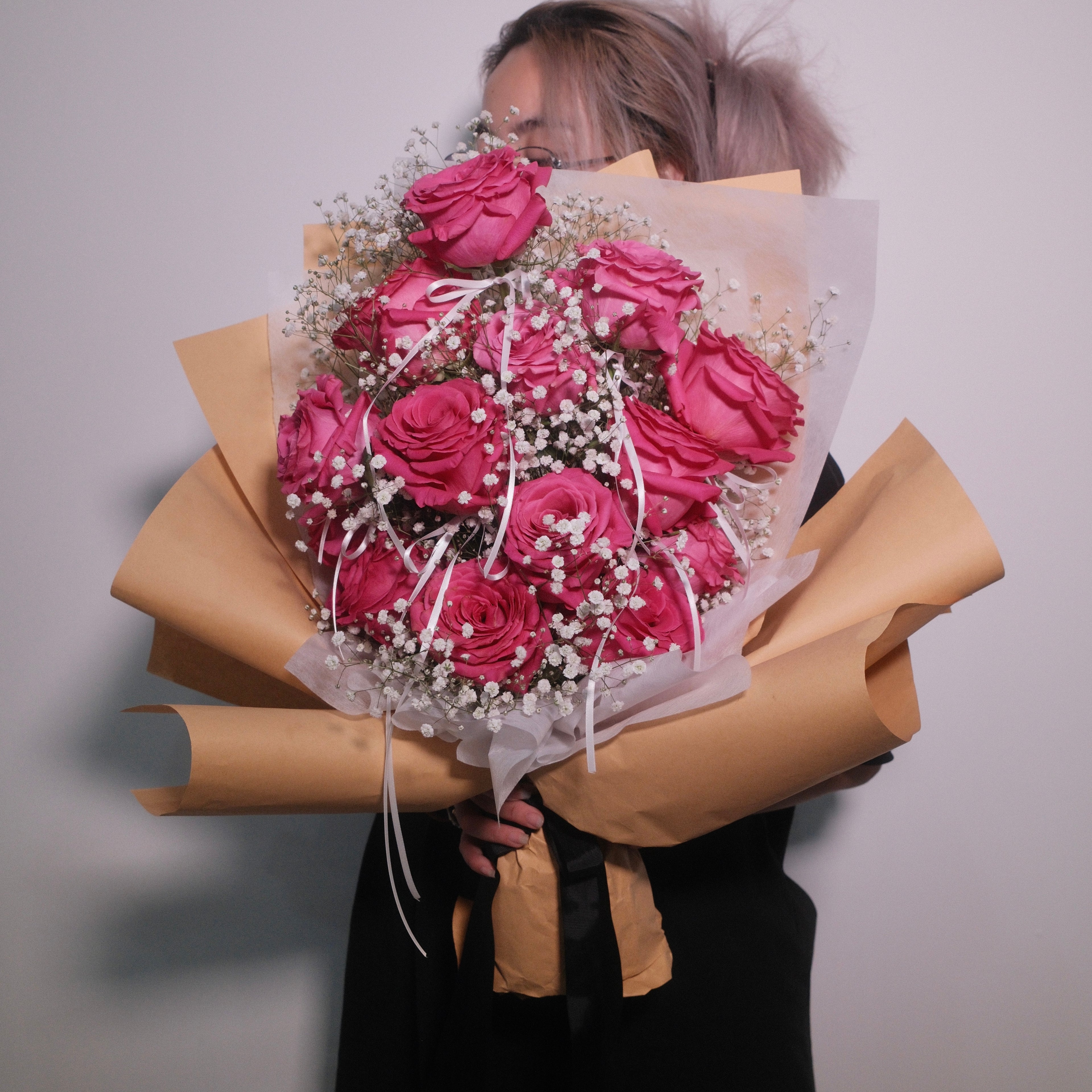 Romantic bouquet of pink roses with baby breath wrapped in brown kraft paper, Hanaya Flora, Surry Hills, Sydney.