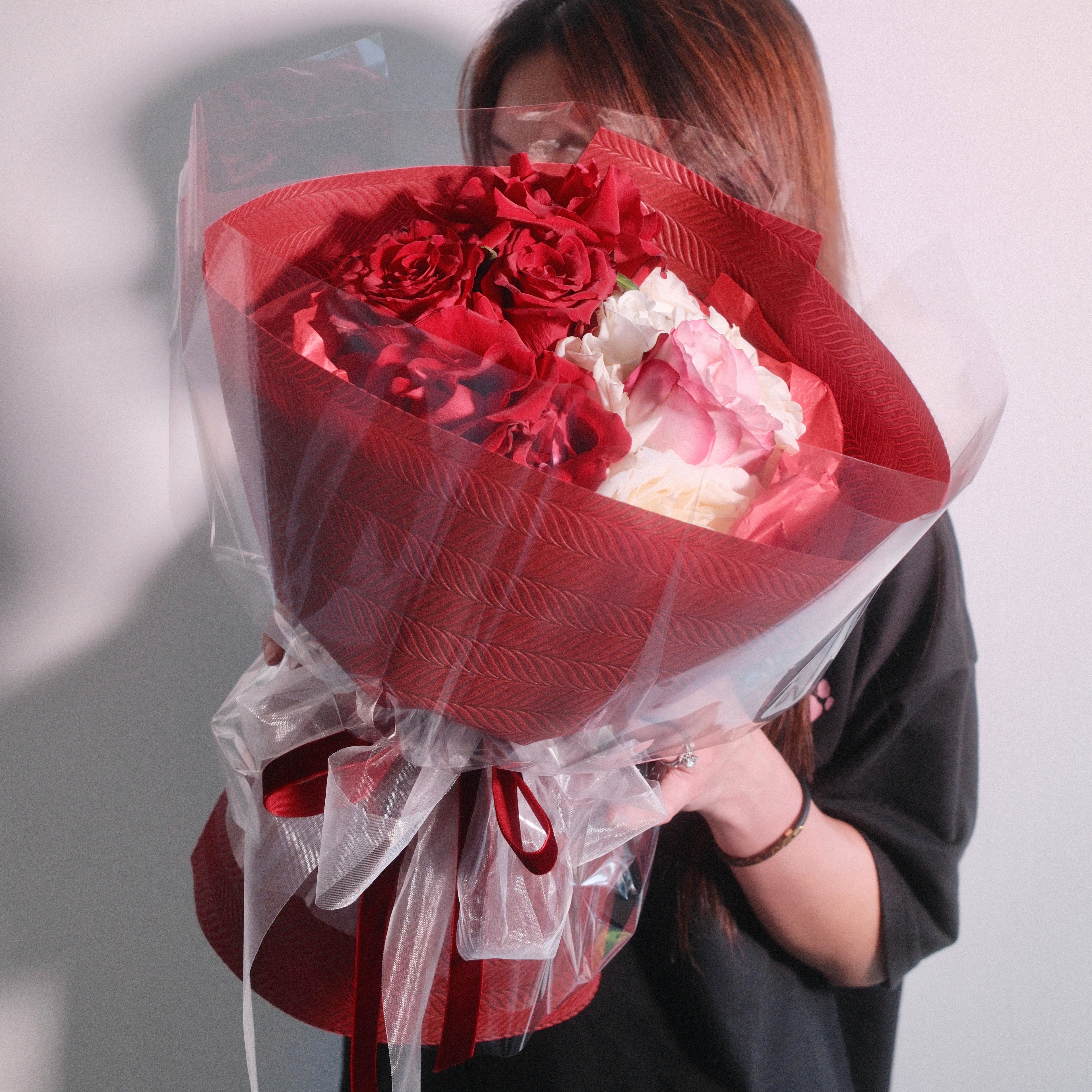 Red roses flower bouquet wrapped in red, perfect gift for mum or a partner by Hanaya Flora.