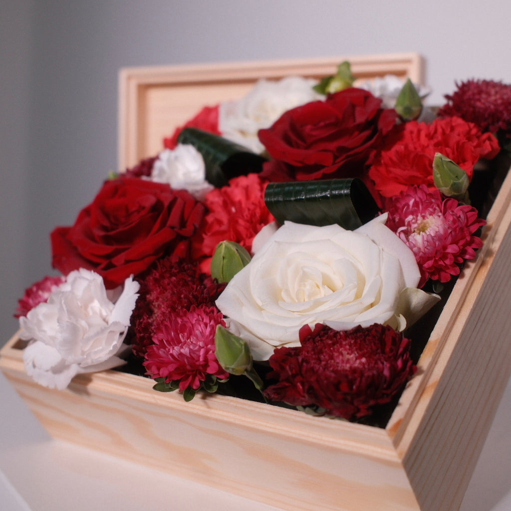 Hanaya Box Red (W) detail with red roses, carnations and chrysanthemums