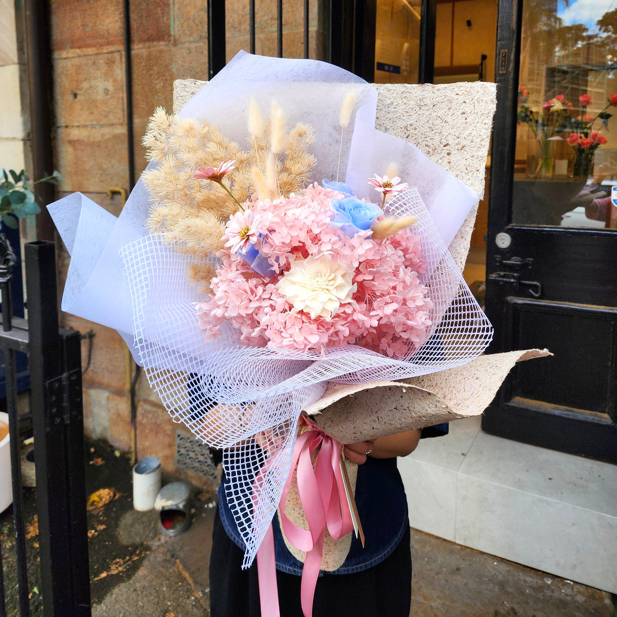 Sakura Dream dried and preserved flower bouquet in white mesh wrap with pink ribbon, Surry Hills florist Hanaya Flora