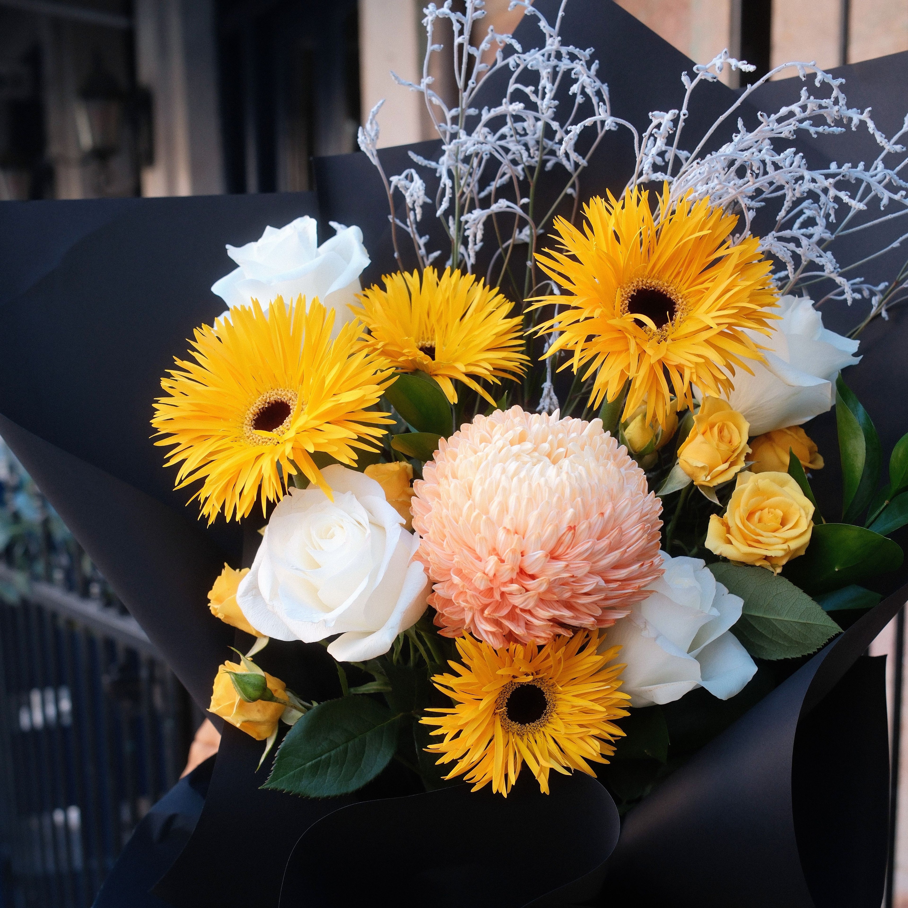 Close-up of Sunny Wishes bouquet featuring yellow gerbera, peach chrysanthemum, white roses and frosted smokebush, Hanaya Flora