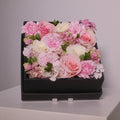 Square black gift box filled with pink rose and white rose flowers, by Hanaya flora, Sydney.