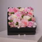 Square black gift box filled with pink rose and white rose flowers, by Hanaya flora, Sydney.