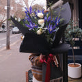 Florist holding the Yozora February birthday bouquet on a Surry Hills street, Sydney