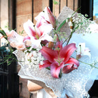 Close-up of pink Oriental lilies, the May birth flower, in the Yuri bouquet