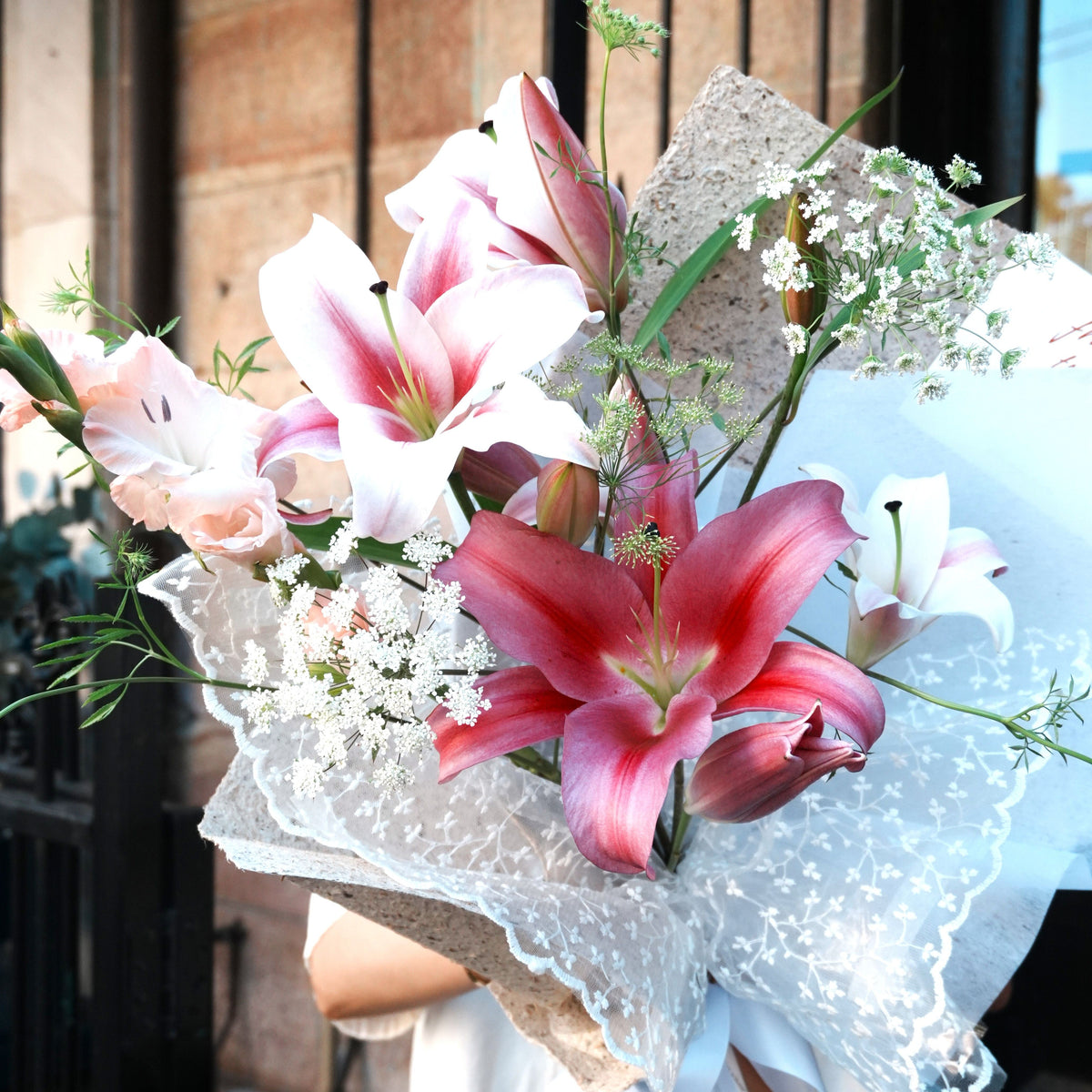 Close-up of pink Oriental lilies, the May birth flower, in the Yuri bouquet